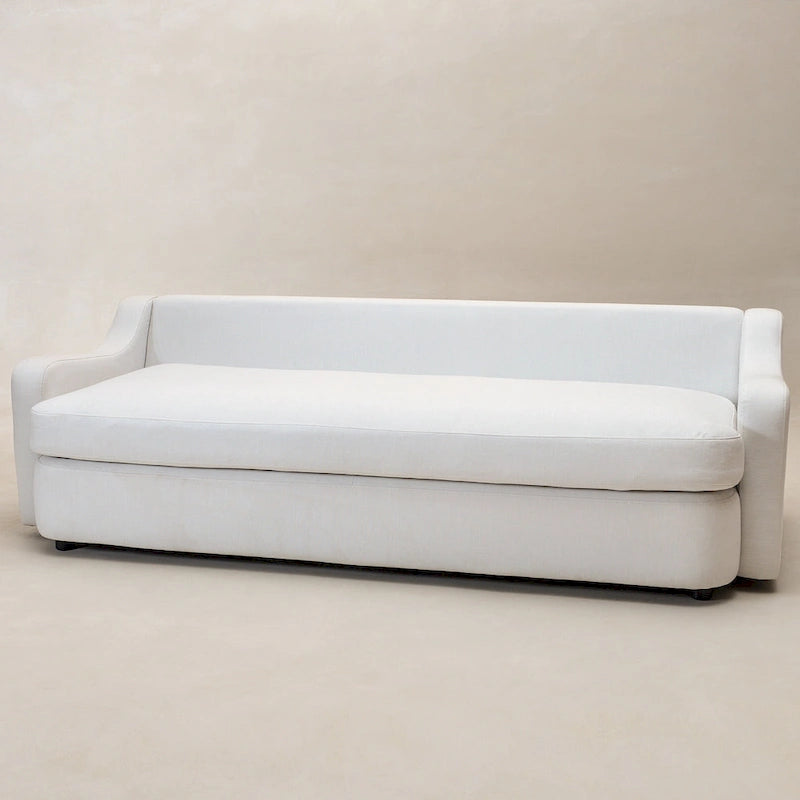 Sofá de tres plazas tapizado en lino con asientos profundos y cojines reversibles